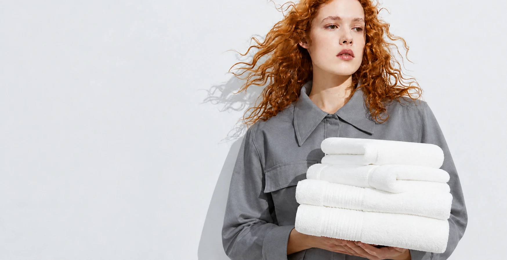 Girl holding some white tovels